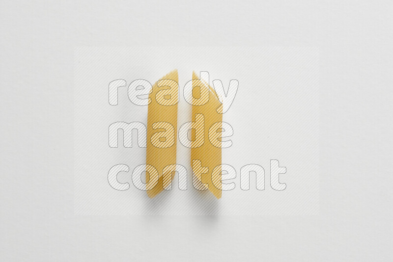 Penne pasta on white background