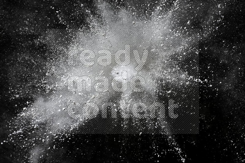 White powder explosion on black background