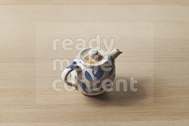 Pottery Teapot on Oak Wooden Flooring, 45 degrees