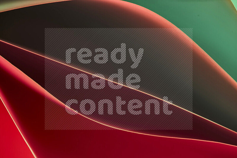 This image showcases an abstract paper art composition with paper curves in green and red gradients created by colored light