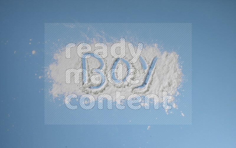 A word written with powder on blue background