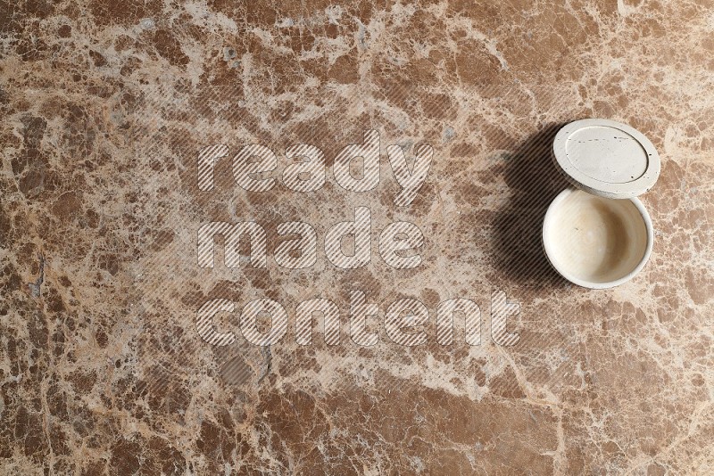 Top View Shot Of A Pottery Cup On beige Marble Flooring