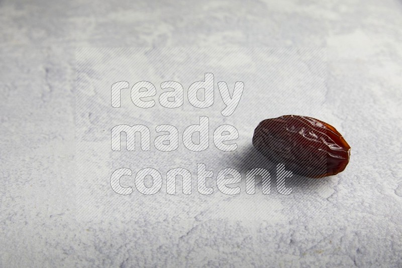 one madjoul date on a light grey background