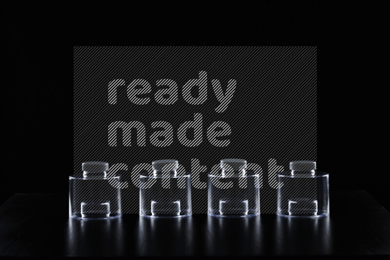 Glassware with rim light against black background