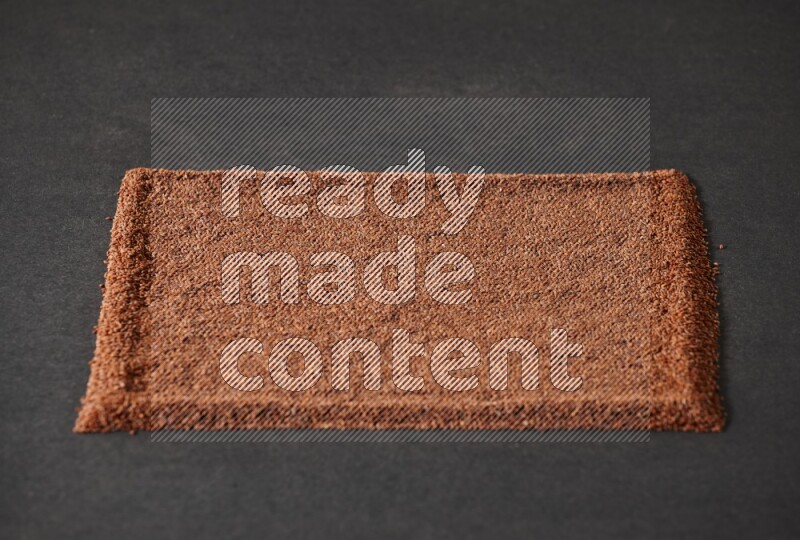 Garden cress seeds filling the frame on a black flooring