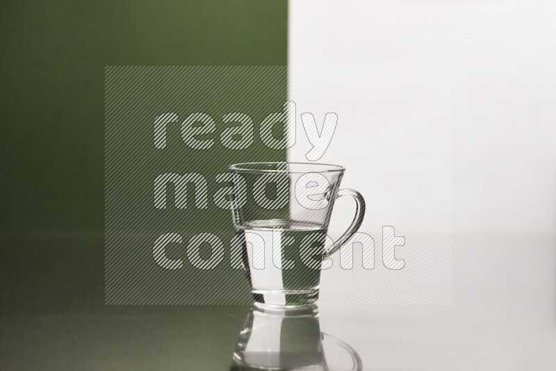 The image features a clear glassware filled with water, set against white and dark green background