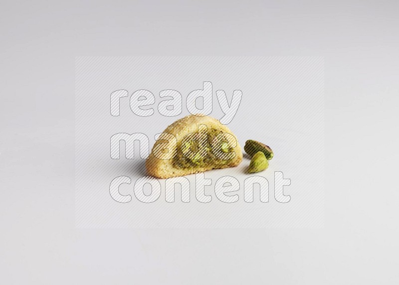 Half Maamoul filled with pistachio direct on white background