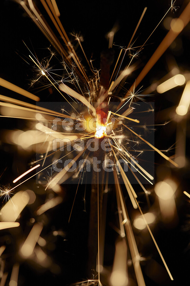 A close-up image of sparkler candle isolated on black background