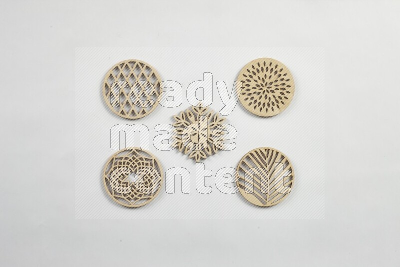 Crafted wooden coasters on white background