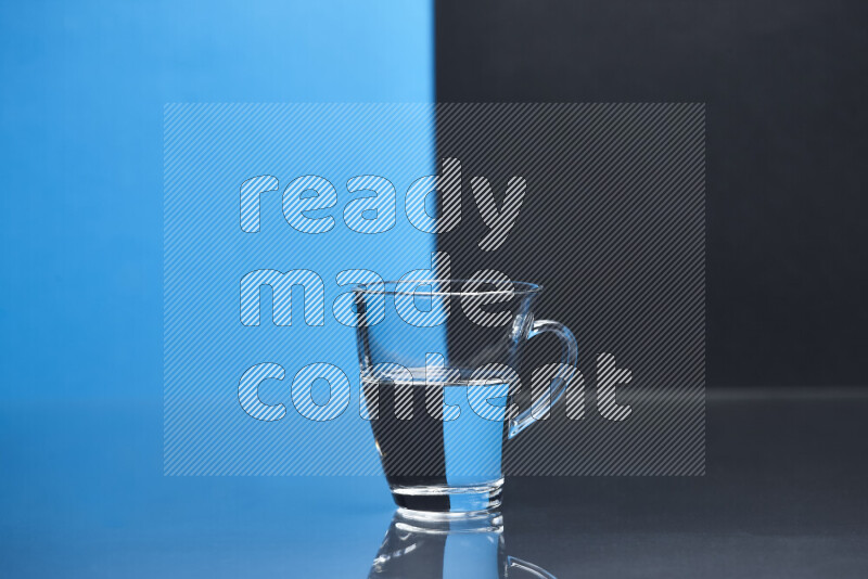 The image features a clear glassware filled with water, set against blue and black background