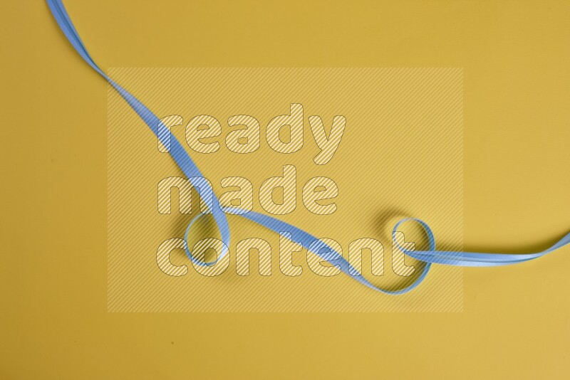 A blue collection of sewing and tailoring tools arranged on a yellow background