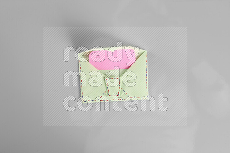 Origami envelope on grey background