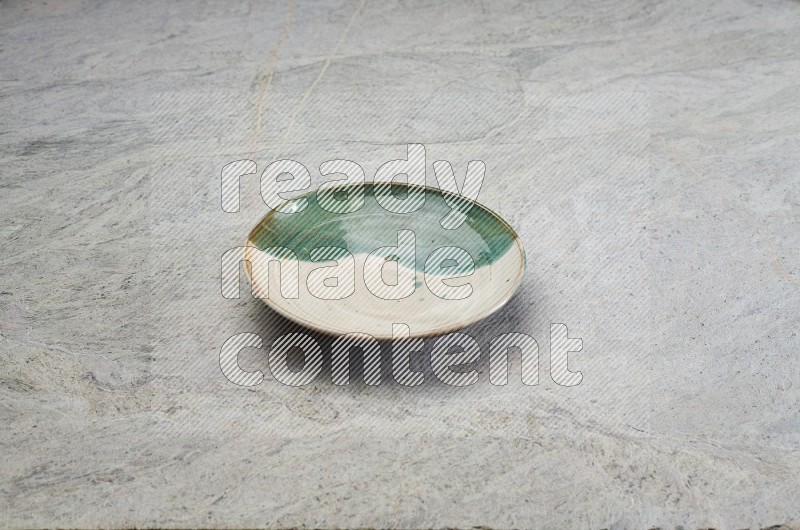 Decorative Pottery Plate On Grey Marble Flooring