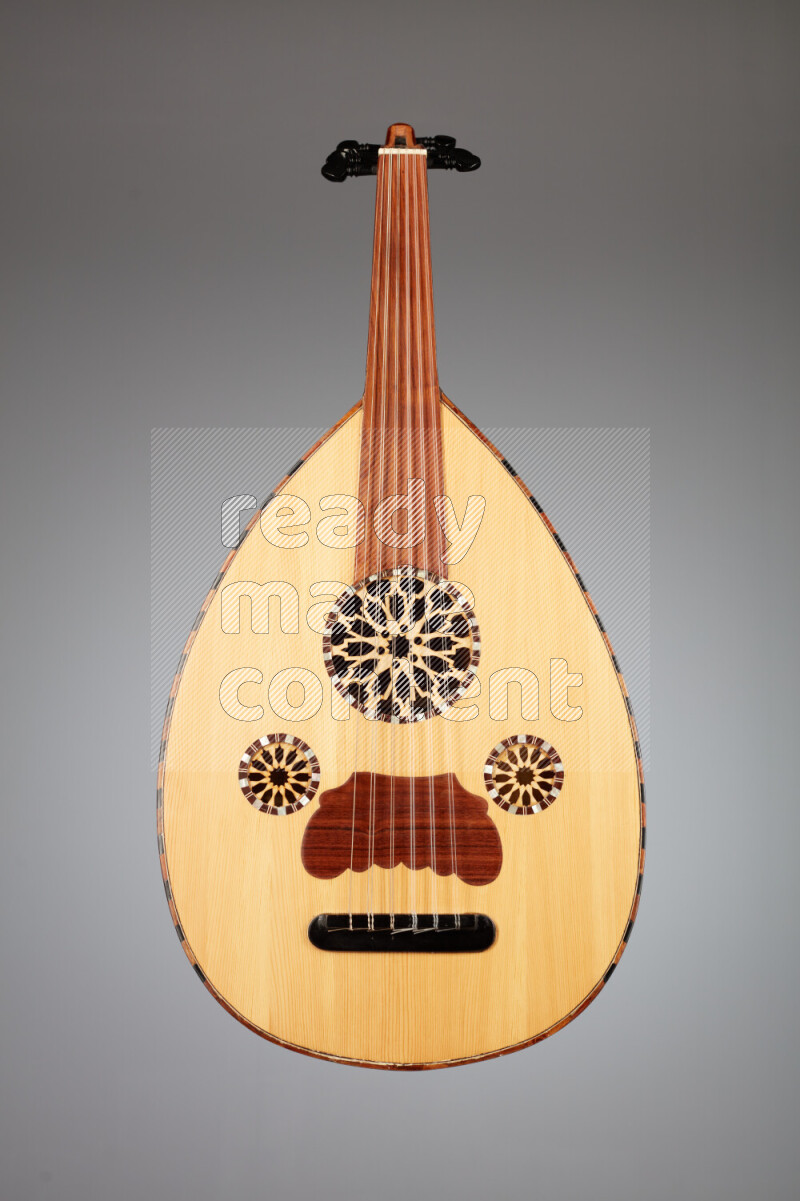 a wooden brown Oud on a gray background