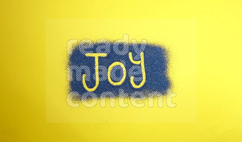 A word written with blue glitter on yellow background