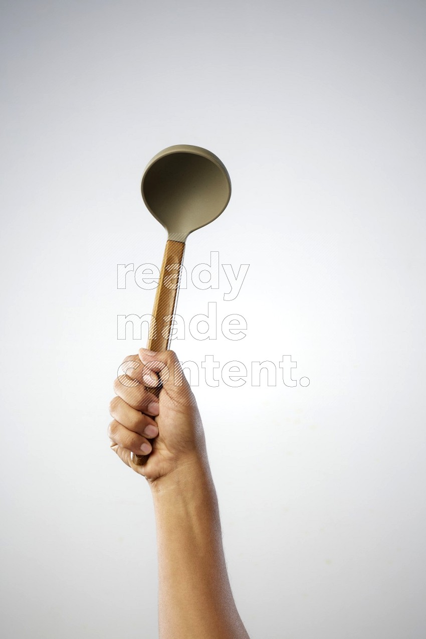Male Hand Holding ladle on white background