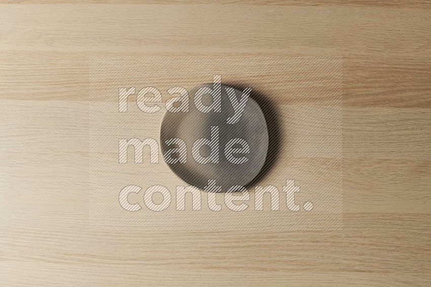 Top View Shot Of A Multicolored Pottery Plate on Oak Wooden Flooring