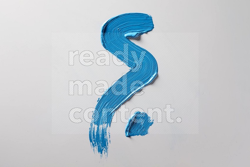 A single blue zigzag brush stroke on a white background