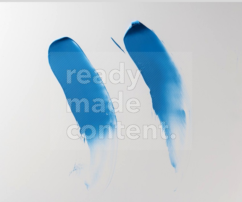 Blue curved painting knife strokes on white background