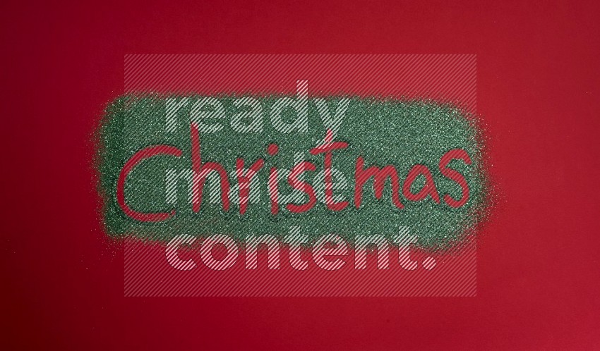 A word written with green glitter on red background